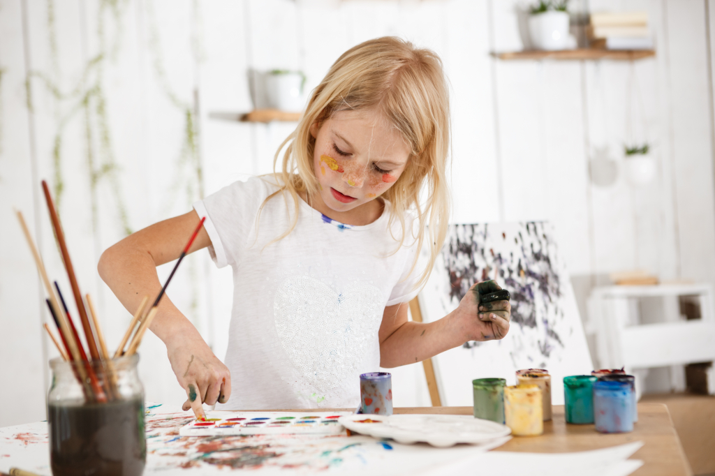 creative-beautiful-female-child-with-blonde-hair-working-her-picture-art-room.jpg