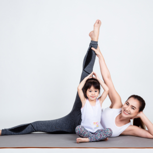 young-mother-training-lovely-daughter-with-yoga.jpg